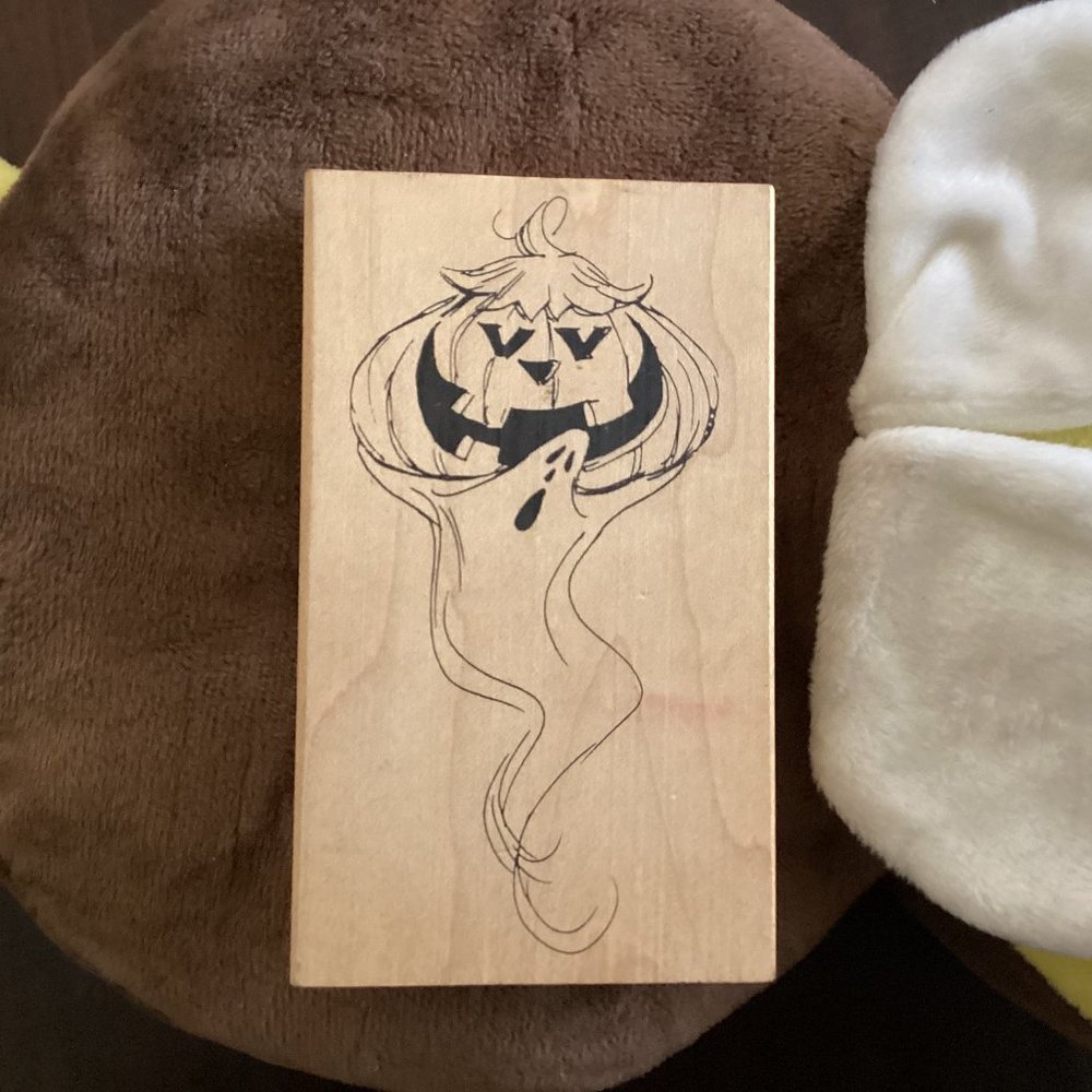 Ghost holding up Pumpkin by Judith Rubber Stamp
